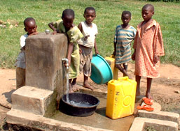 Uganda children at water tap