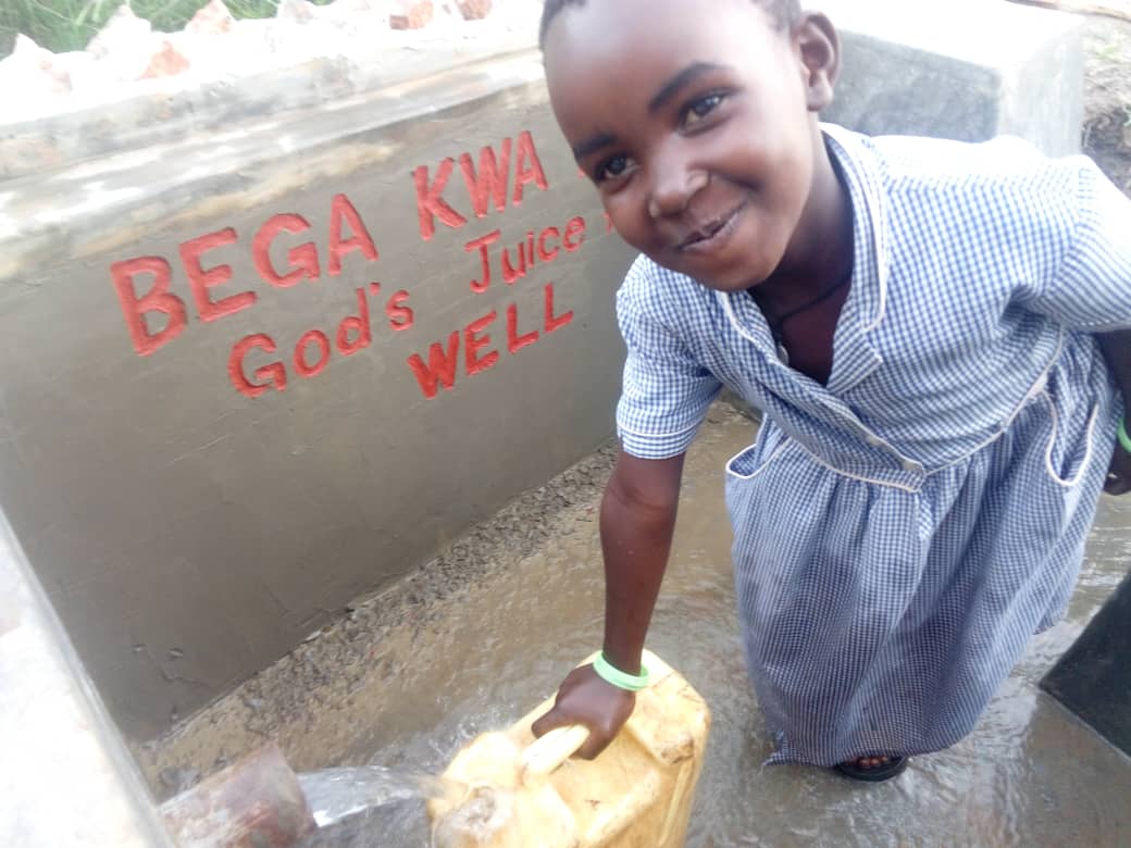 BWA — BkB Water Girl Sign-20190502-WA0014 (002) Little girl in Uganda gets safe drinking water at well