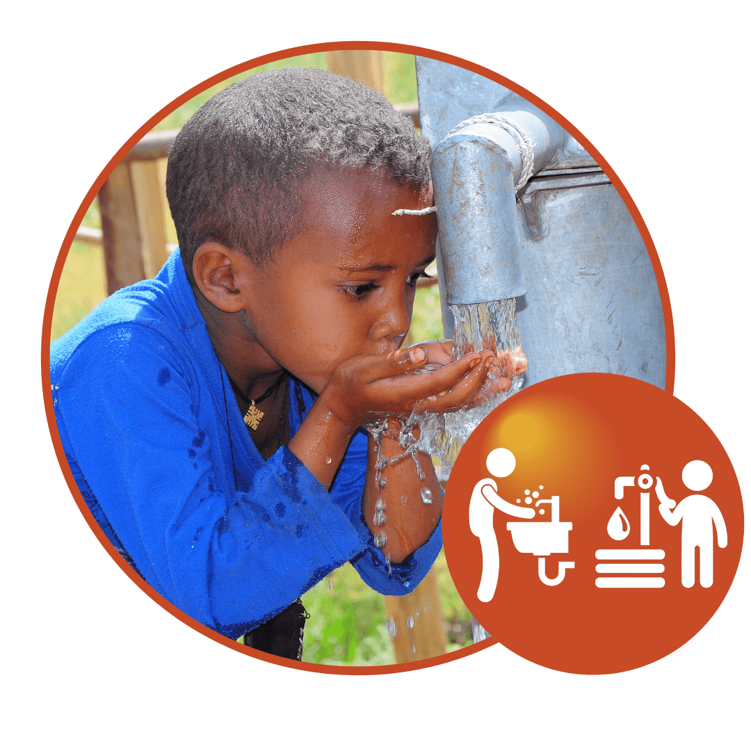 Child drinking clean water from a water well.