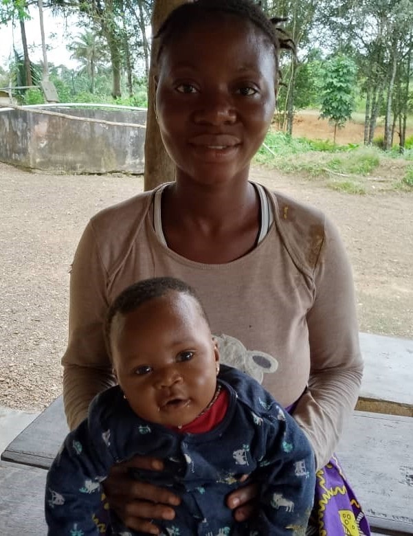Isata holds her son, Brima, who was successfully treated for malaria in Sierra Leone with drugs from our partners.