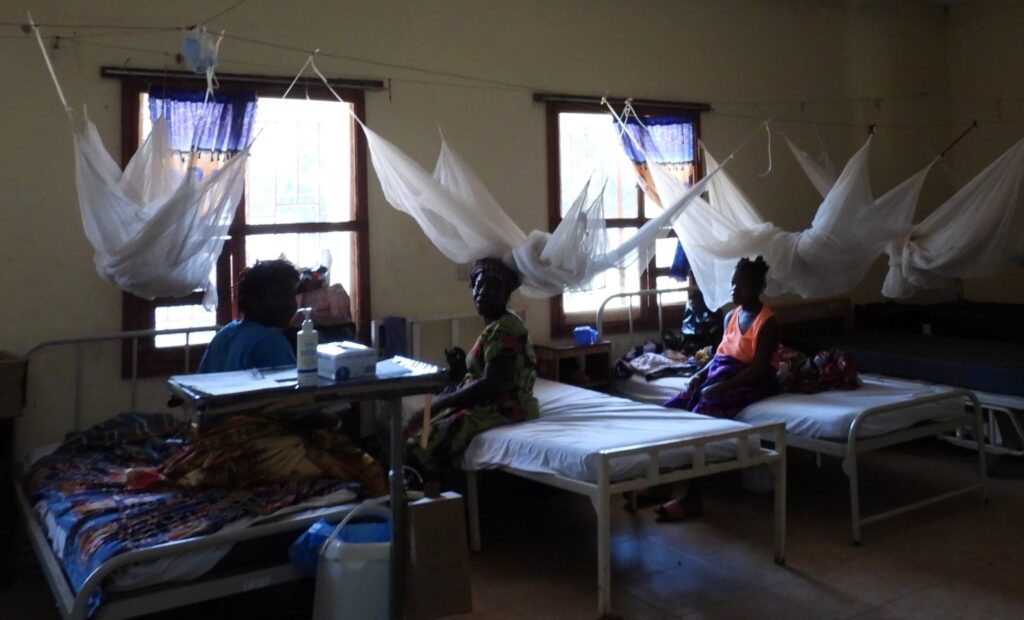 Patients rest in beds protected by mosquito nets at the Serabu Hospital in Sierra Leone, a partner of Bread and Water for Africa.