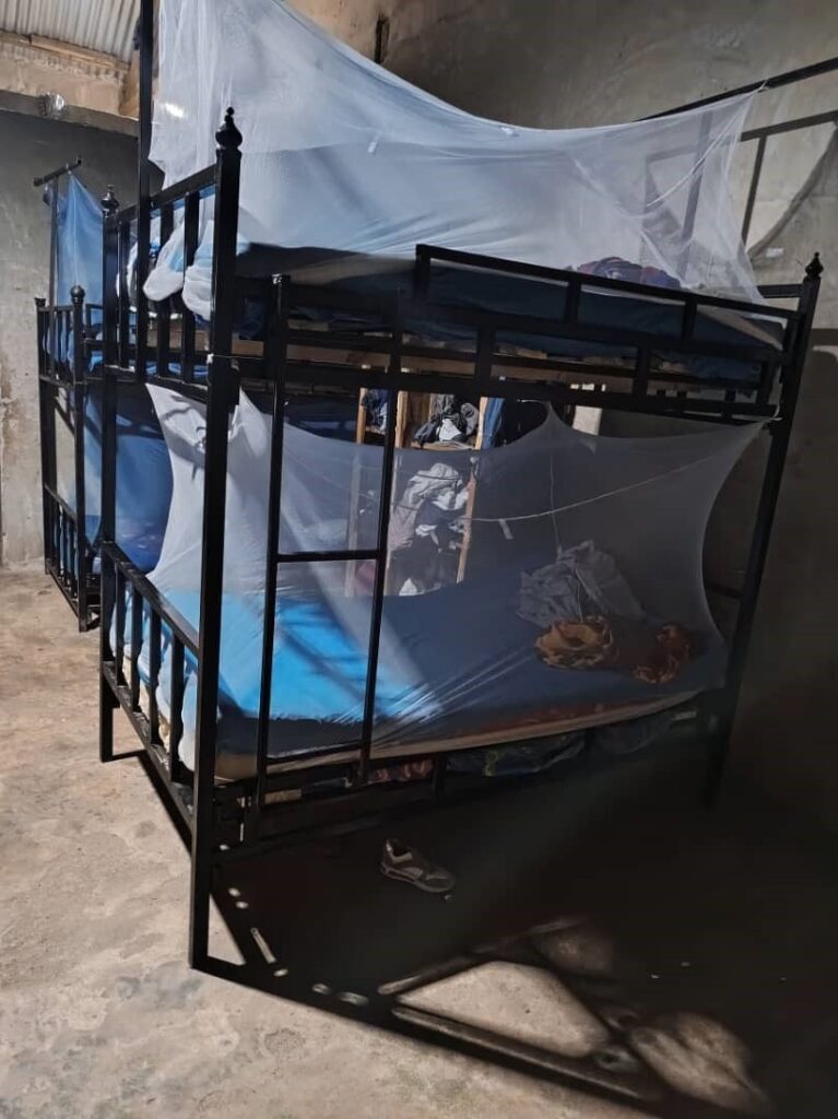 Bunk beds in a dormitory at the Watoto Wa Africa orphanage are fitted with protective mosquito nets to prevent malaria.
