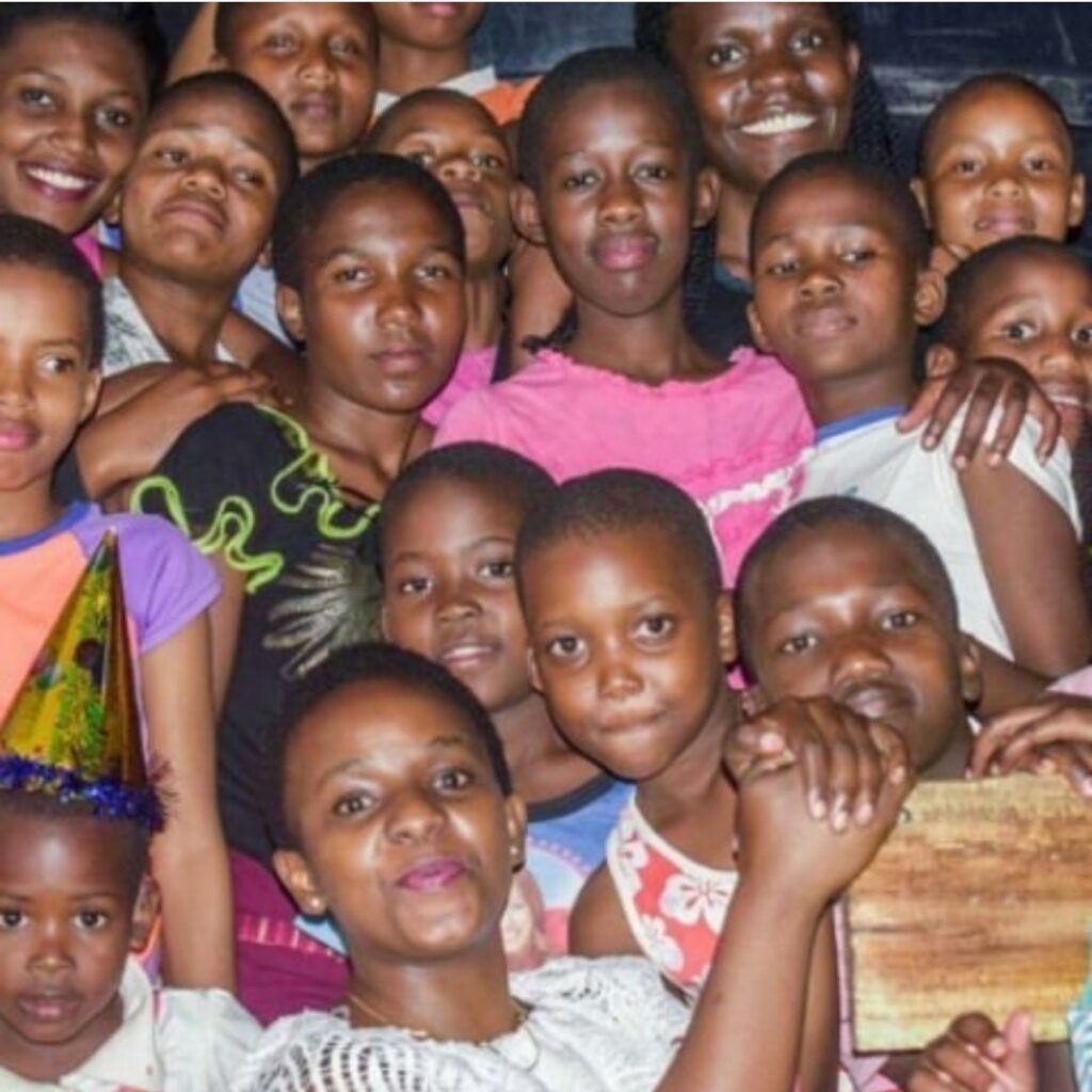The children and staff of the Watoto Wa Africa Orphanage, a safe and nurturing home for 108 children in Tanzania.