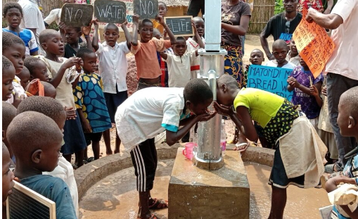 Children in DRC drinking from a new clean water well.