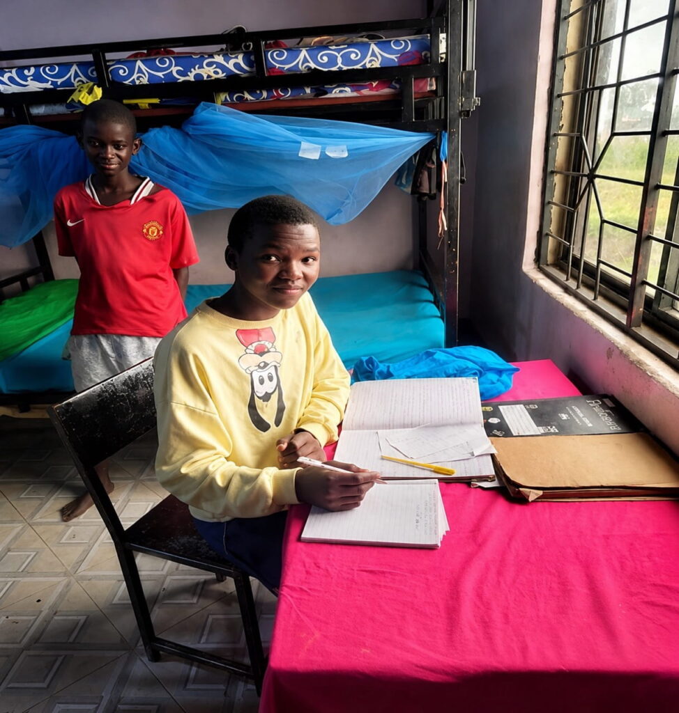 Benson studying at Watoto Wa Africa Orphanage in Tanzania with support from Bread and Water for Africa